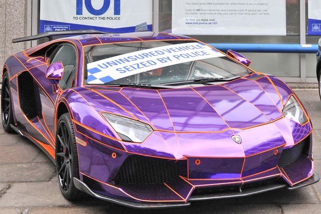 The seized Lamborghini Aventador on display outside New Scotland Yard