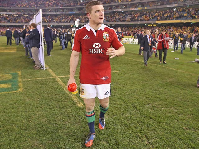 Brian O'Driscoll walks dejectedly off the pitch after defeat in game two