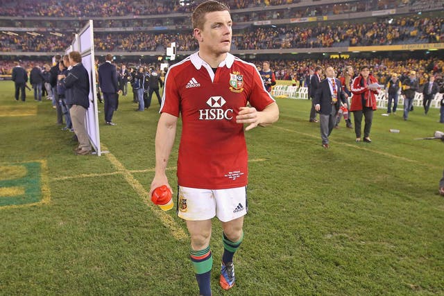 Brian O'Driscoll walks dejectedly off the pitch after defeat in game two