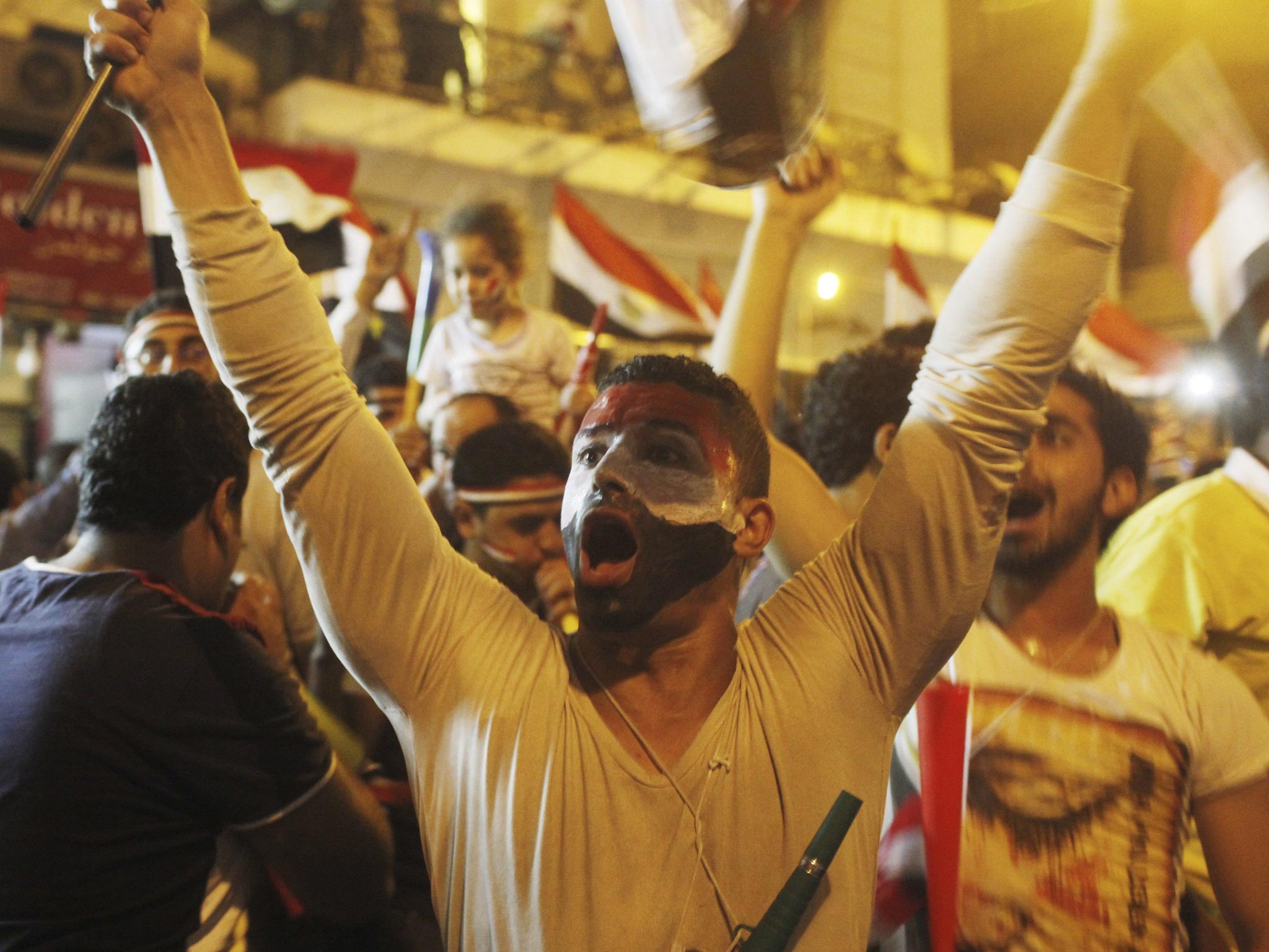 Anti-Morsi protesters chant as they celebrate near Tahrir square in Cairo after the announcement that Egypt's President Mohamed Morsi has been removed