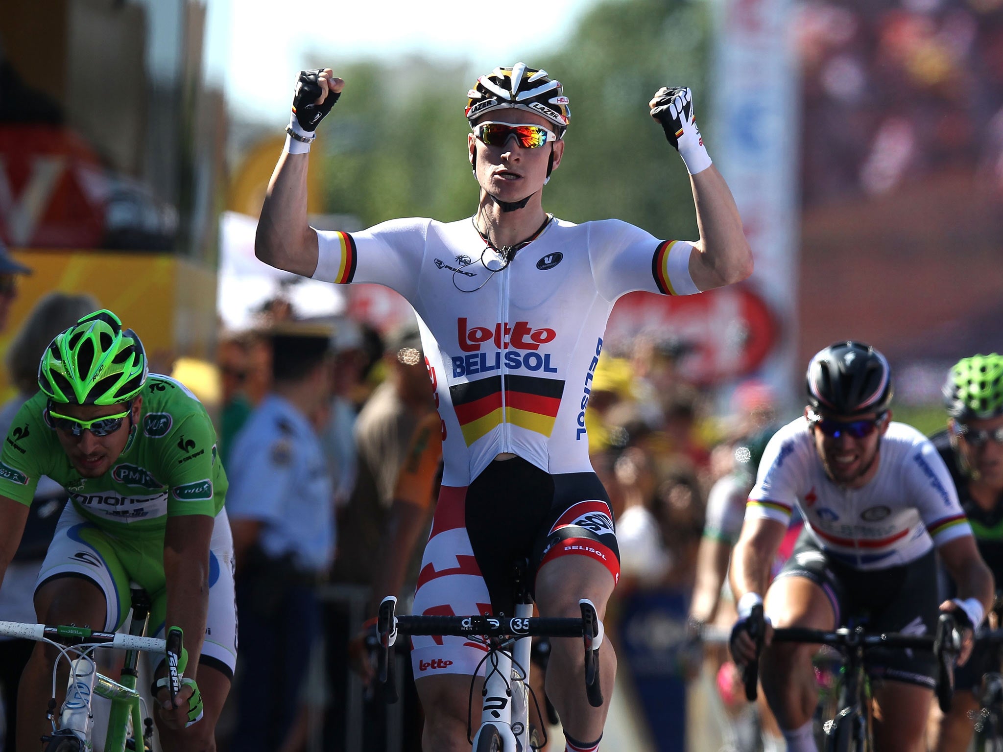 Andre Greipel of Germany and Lotto-Belisol crosses the line to win stage six of the 2013 Tour de France, a 176.5KM road stage from Aix-en-Provence to Montpellier