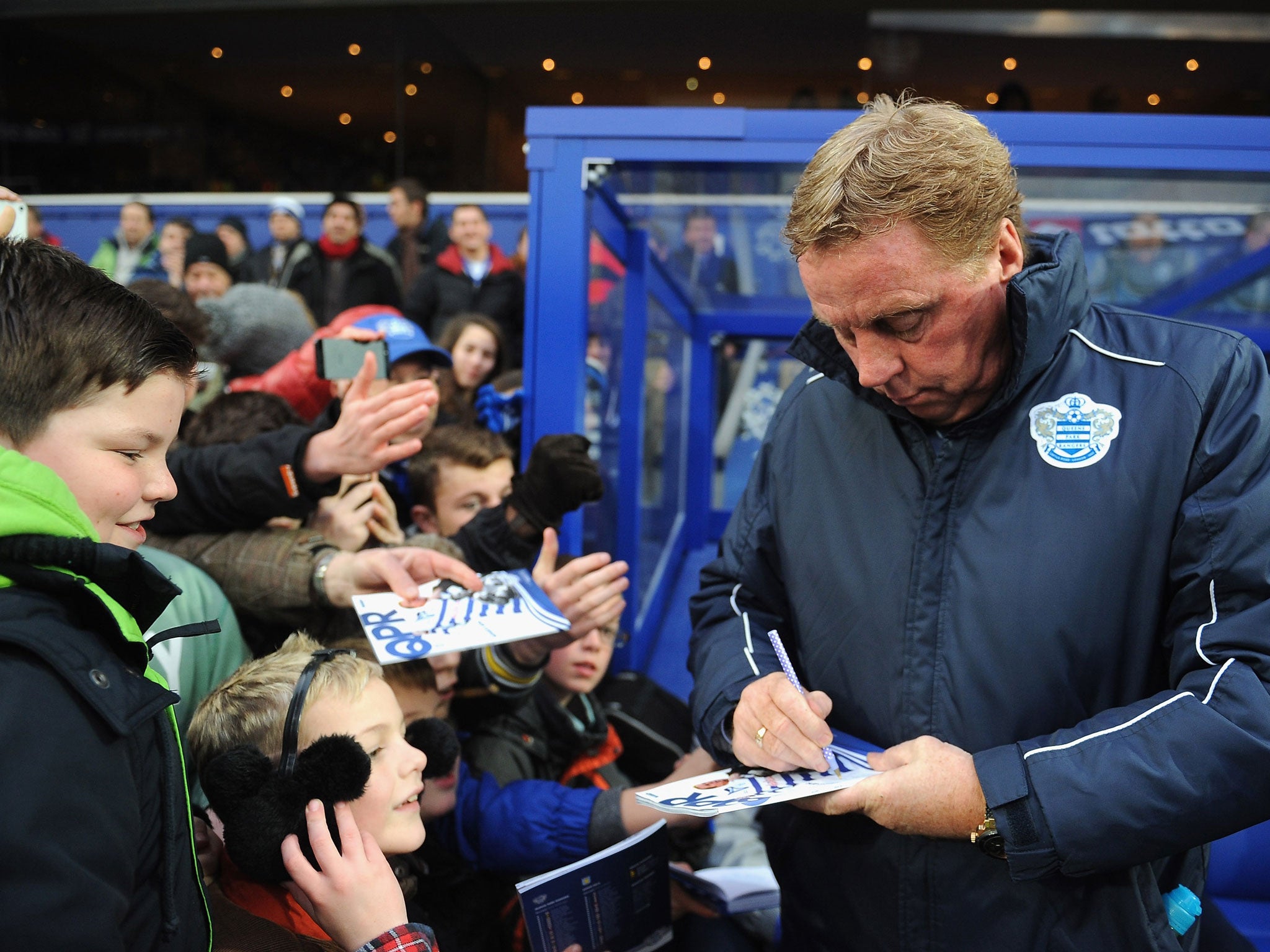 On me pad! Harry Redknapp shows off his penmanship