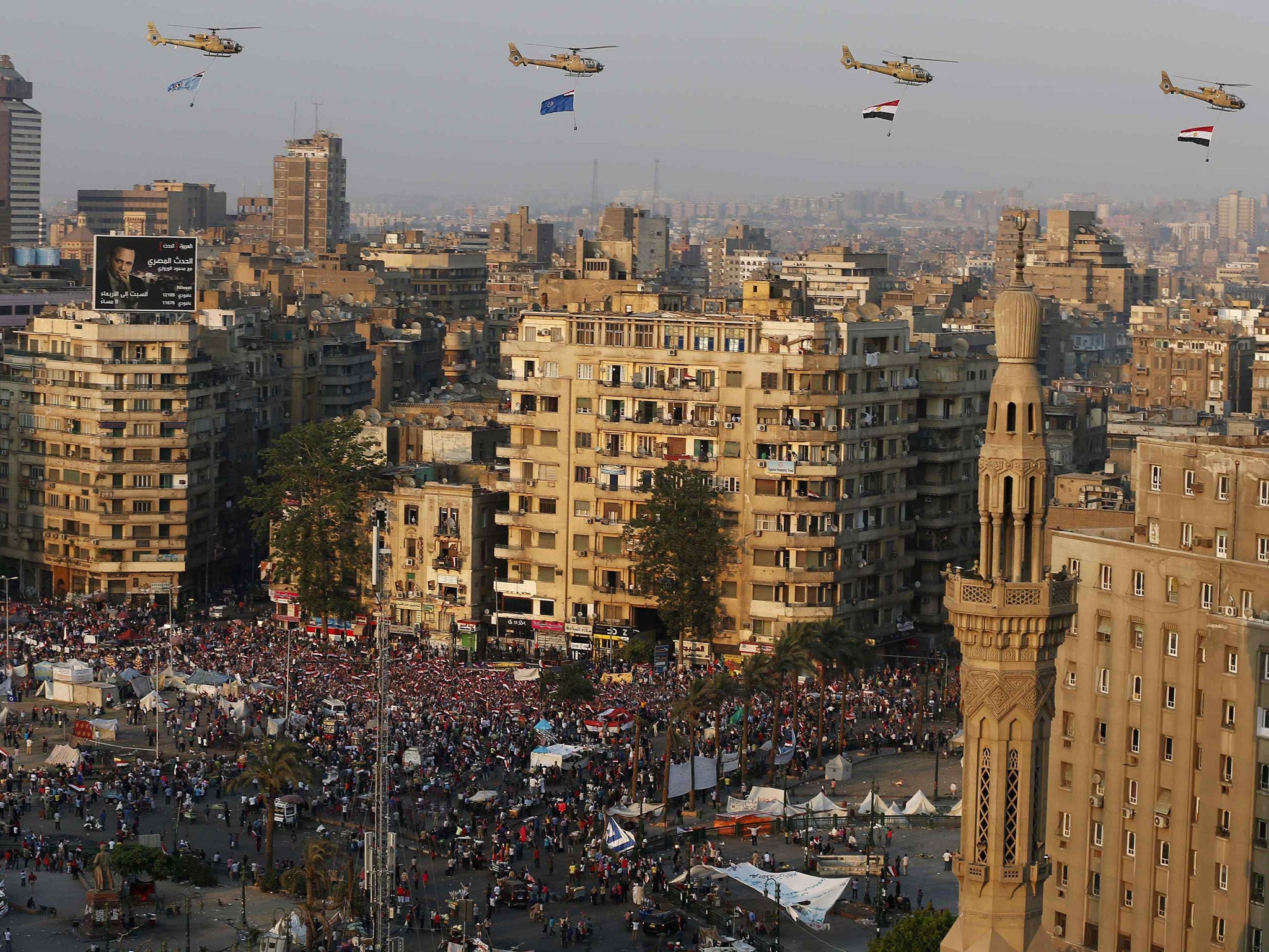A view shows a fly-past over protesters against ousted Egyptian President Mohamed Morsi, in Tahrir Square