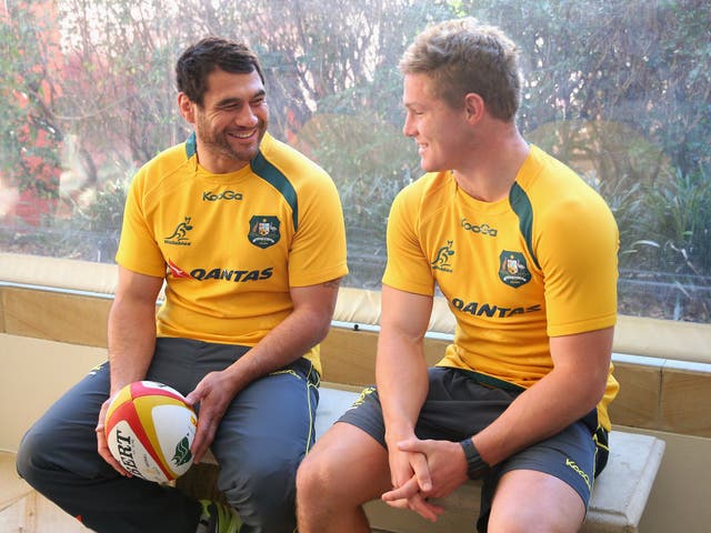 Michael Hooper (right) chats to the man who has replaced him in the Australia side, George Smith, in Sydney