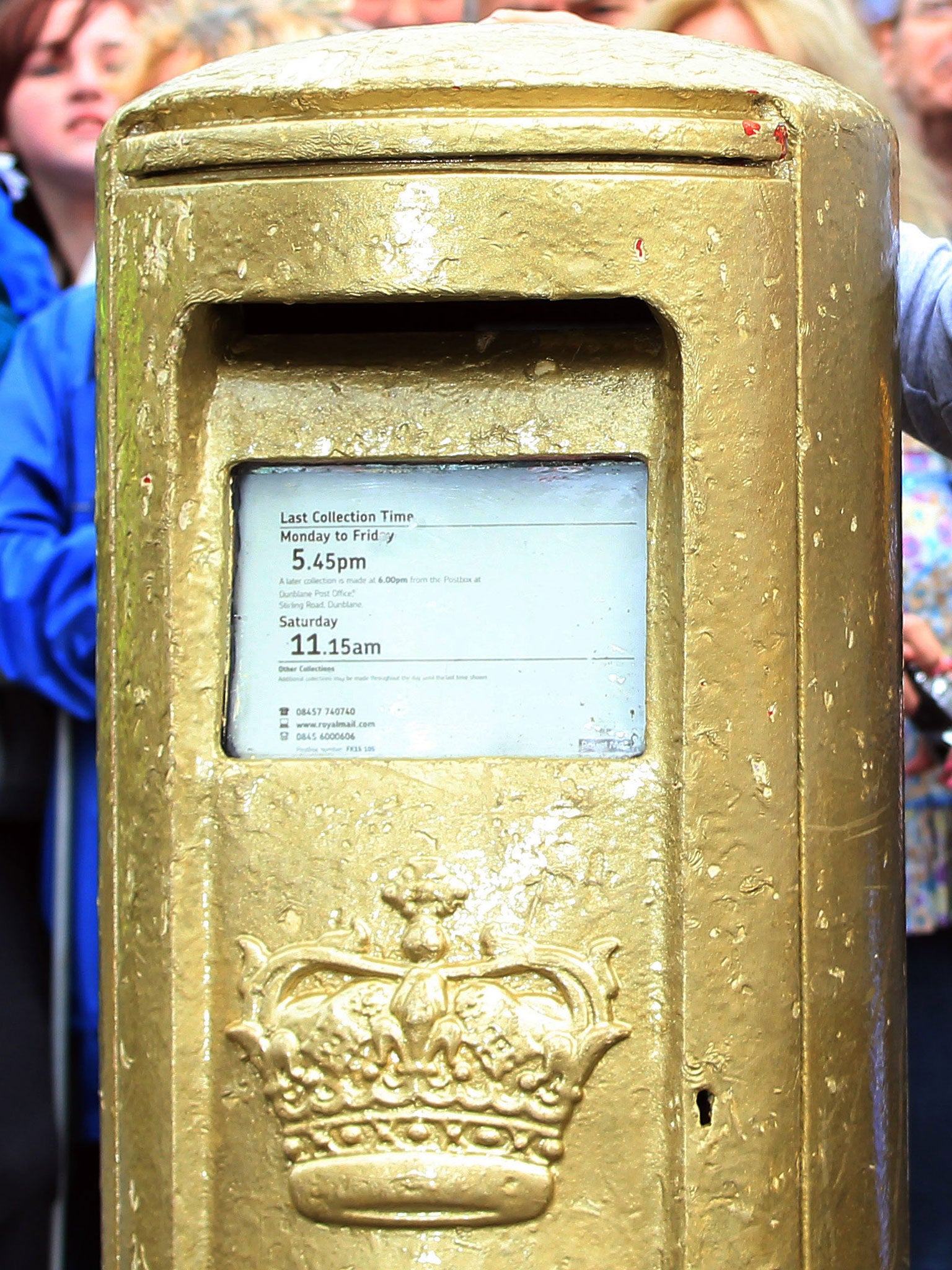 The gold pillar box is a popular spot for photographs just outside the courts
