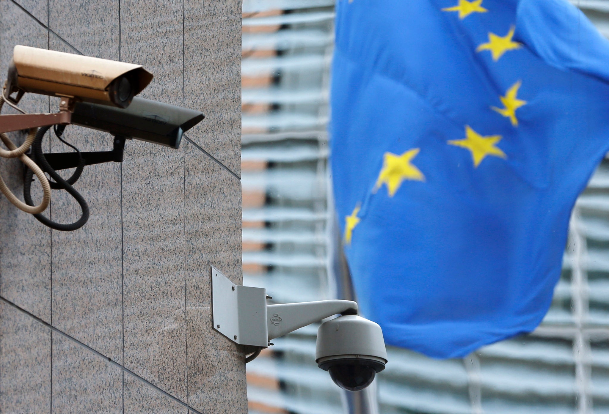 Security cameras are seen near the main entrance of the European Union Council building in Brussels July 1, 2013. The European Union said on Monday it had ordered a security sweep of EU buildings after reports that a U.S. spy agency had bugged EU offices