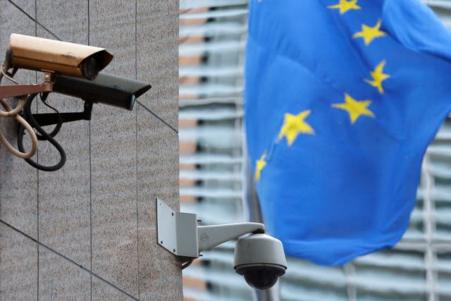 Security cameras are seen near the main entrance of the European Union Council building in Brussels July 1, 2013. The European Union said on Monday it had ordered a security sweep of EU buildings after reports that a U.S. spy agency had bugged EU offices 