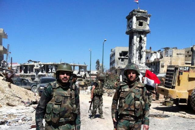 Syrian government soldiers in the main square of the city of Qusayr, near the Lebanese border