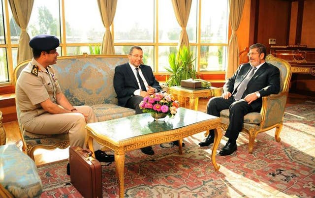 1 July 1 2013: President Mohammed Morsi, right, meets with Prime Minister Hesham Kandil, centre, and the Egyptian Minister of Defense, Lt. Gen. Abdel-Fattah el-Sissi