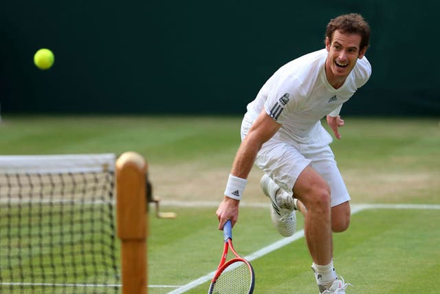Andy Murray stretches to return the ball during his victory on Centre Court