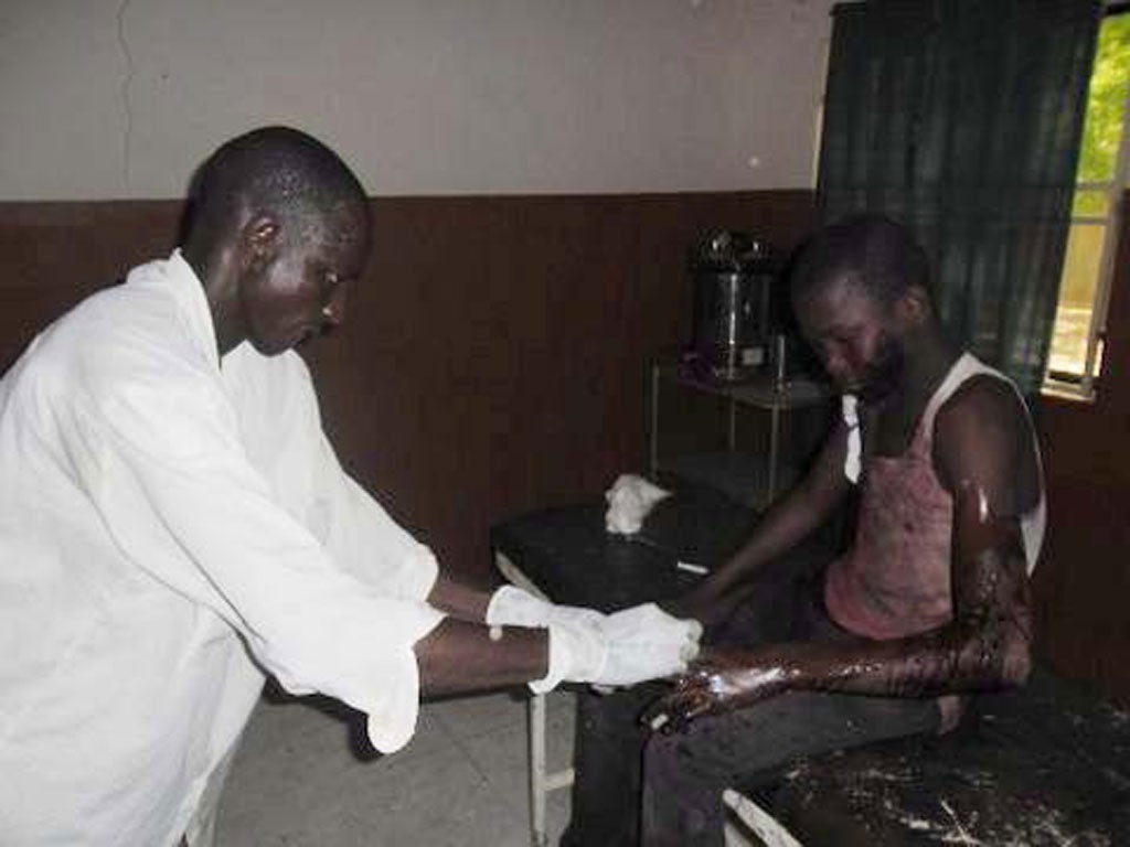 Wave of terror: A doctor attends to a student from Government Secondary School after the attack