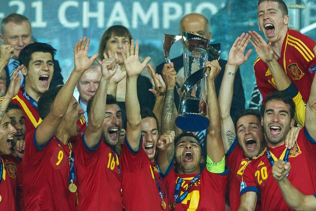 Reign in Spain: The Under-21s celebrate winning the European Championship, in which England flopped badly