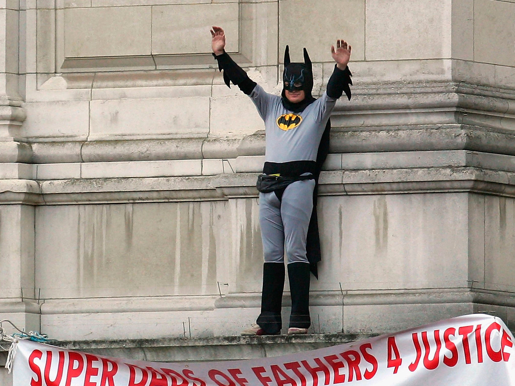 September 2004: A Fathers4Justice campaigner dressed as Batman protests on the balcony at Buckingham Palace