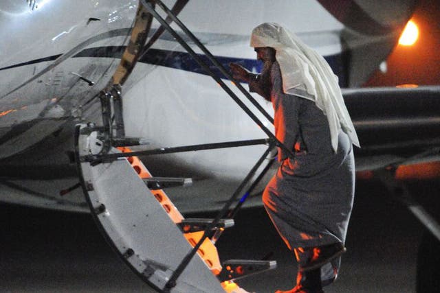A photograph issued by the Ministry of Defence of Abu Qatada at RAF Northolt  in West London boarding a private flight bound for Jordan