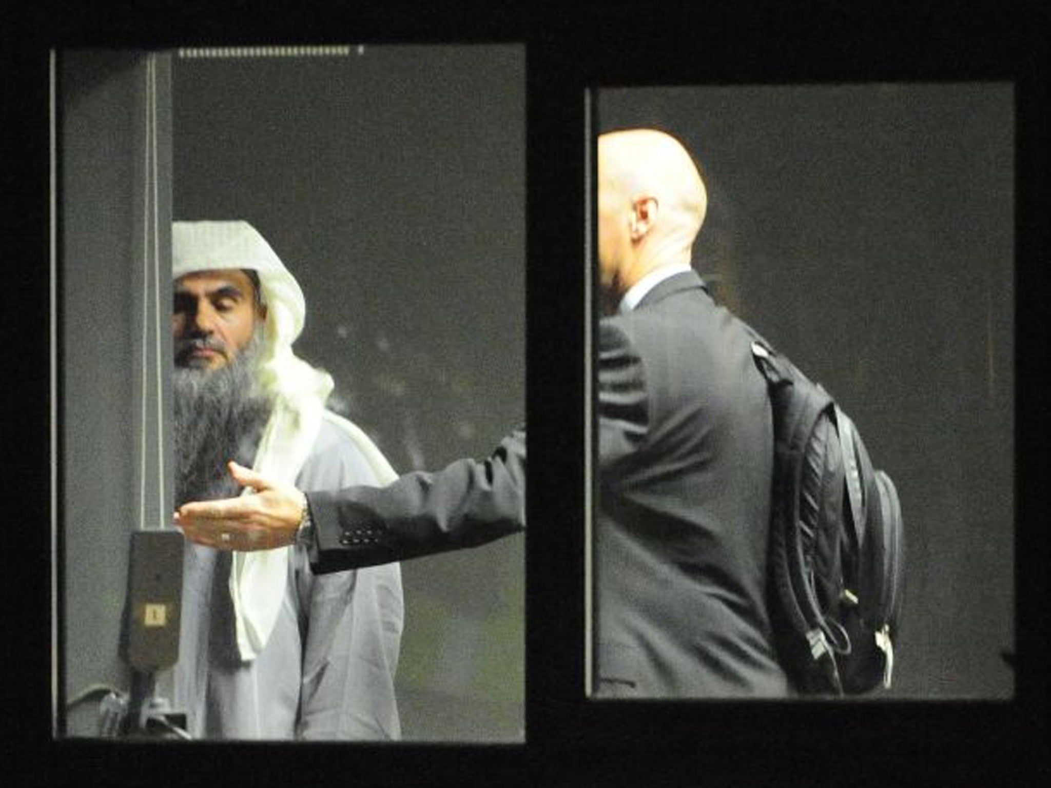 A photograph issued by the Ministry of Defence of Abu Qatada (left) at RAF Northolt in West London where he boarded a private flight bound for Jordan
