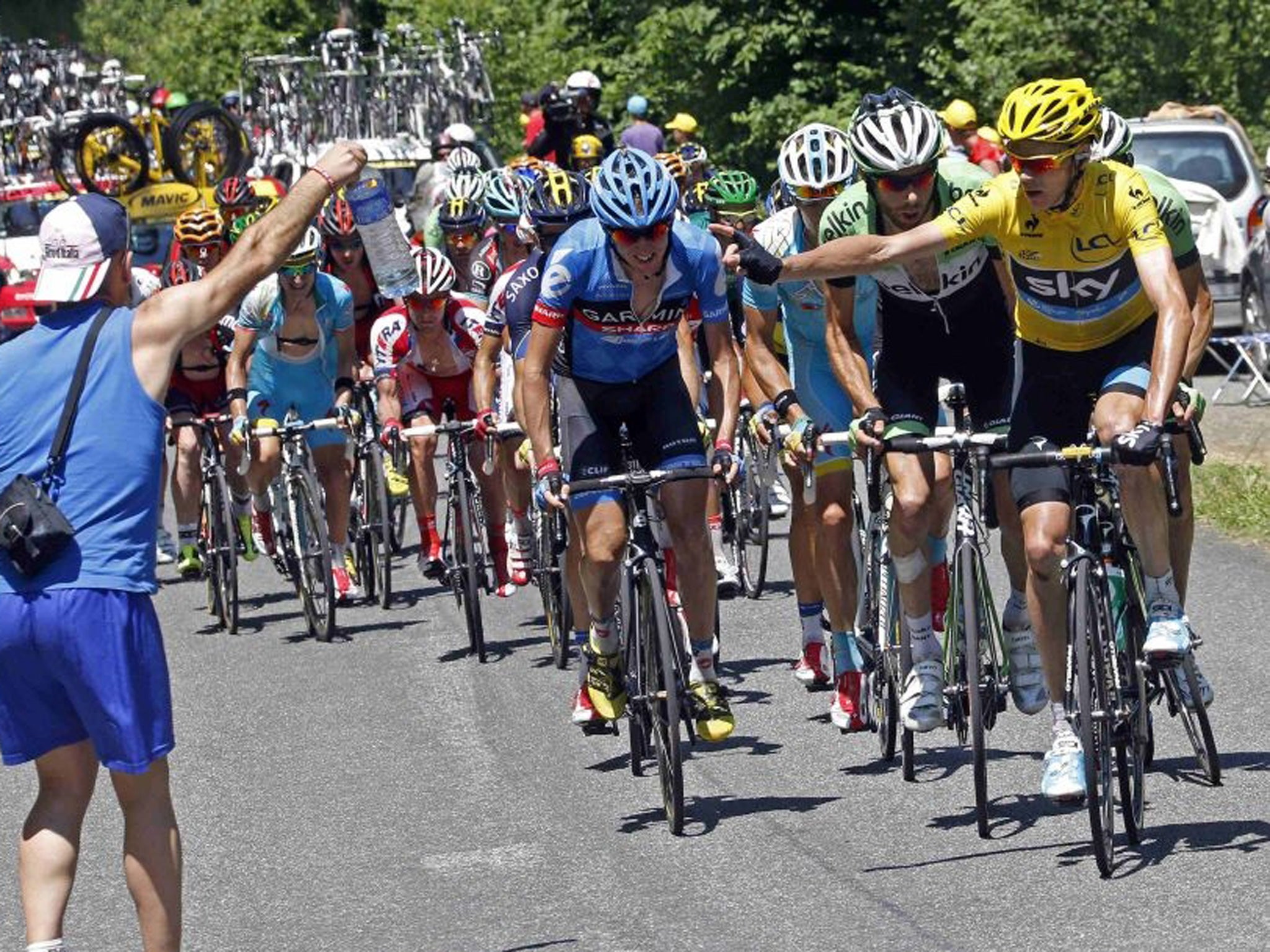 Yellow jersey holder Team Sky rider Christopher Froome of Britain cycles heads the pack during the 168.5 km ninth stage of the Tour de France from Saint-Girons to Bagneres-de-Bigorre