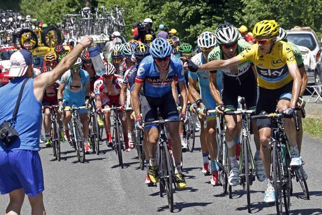 Yellow jersey holder Team Sky rider Christopher Froome of Britain cycles heads the pack during the 168.5 km ninth stage of the Tour de France from Saint-Girons to Bagneres-de-Bigorre