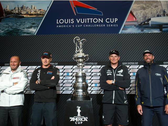 Skippers pose with the America's Cup trophy. From left to right are Luna Rossa Challenge's Max Sirena, Team Oracle USA's Jimmy Spithill, Emirates Team New Zealand's Dean Barker and Artemis Racing's Iain Percy. 