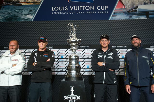 Skippers pose with the America's Cup trophy. From left to right are Luna Rossa Challenge's Max Sirena, Team Oracle USA's Jimmy Spithill, Emirates Team New Zealand's Dean Barker and Artemis Racing's Iain Percy. 