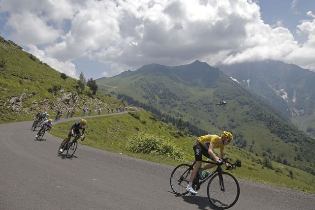 Chris Froome, wearing the yellow jersey, speeds down the Val Louron-Azet pass