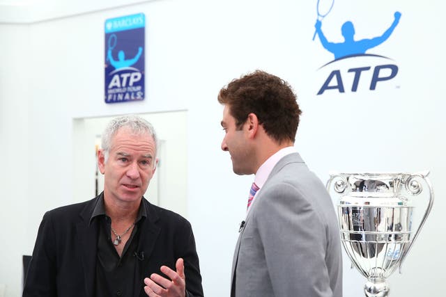 Perhaps John McEnroe, left, was indulging Court One with some more knockabout veteran doubles