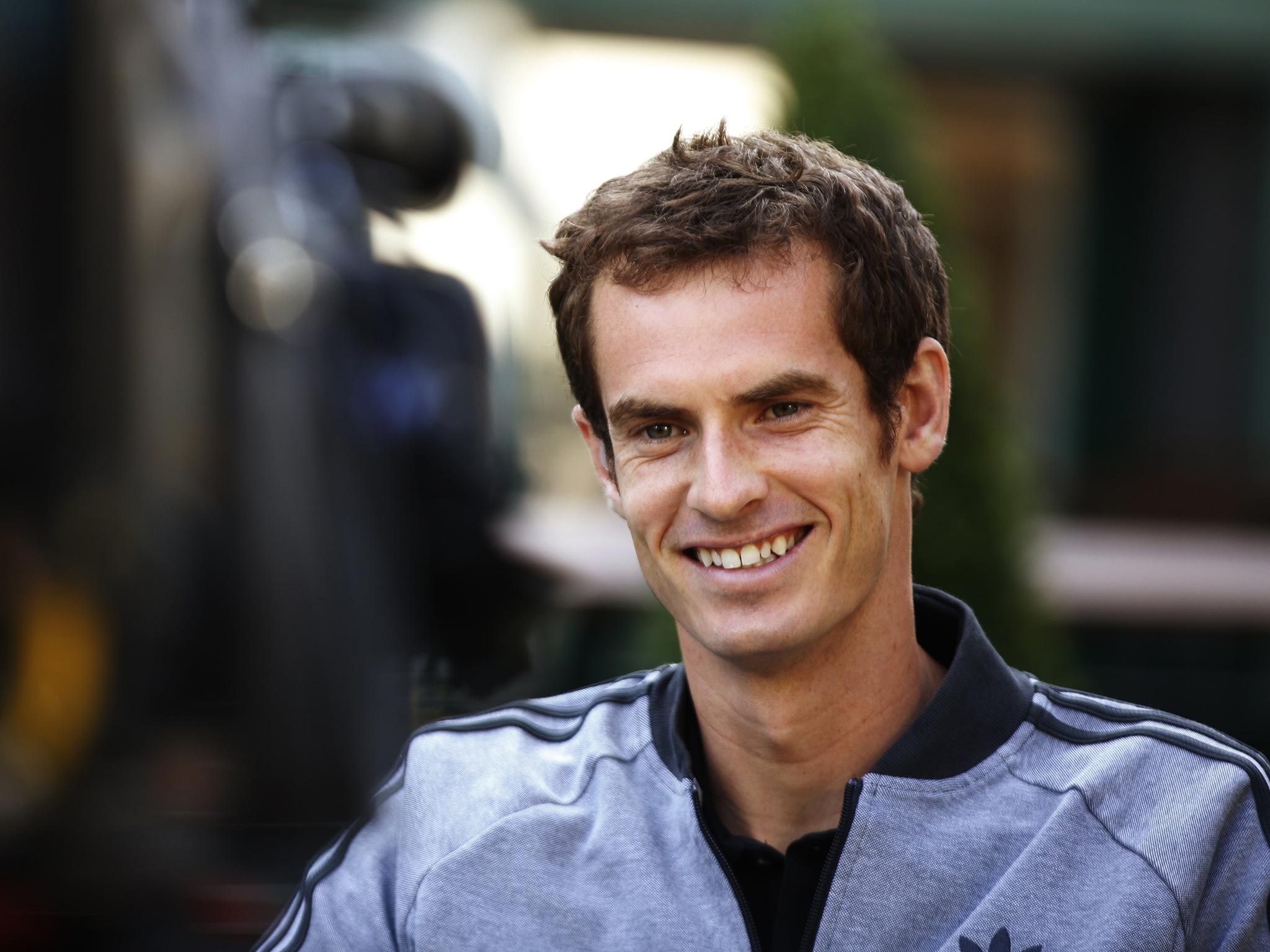 8 July 2013: Tennis player Andy Murray of Britain is interviewed for a breakfast television program the morning after he winning the men's singles title at the Wimbledon Tennis Championships, Wimbledon, southwest London
