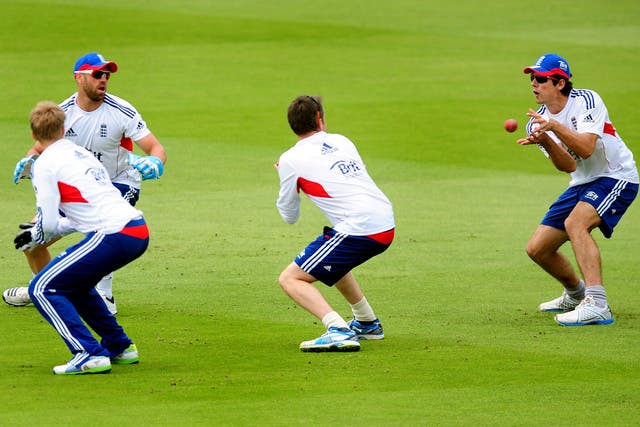 The England captain, Alastair Cook, takes a catch during practice at Trent Bridge