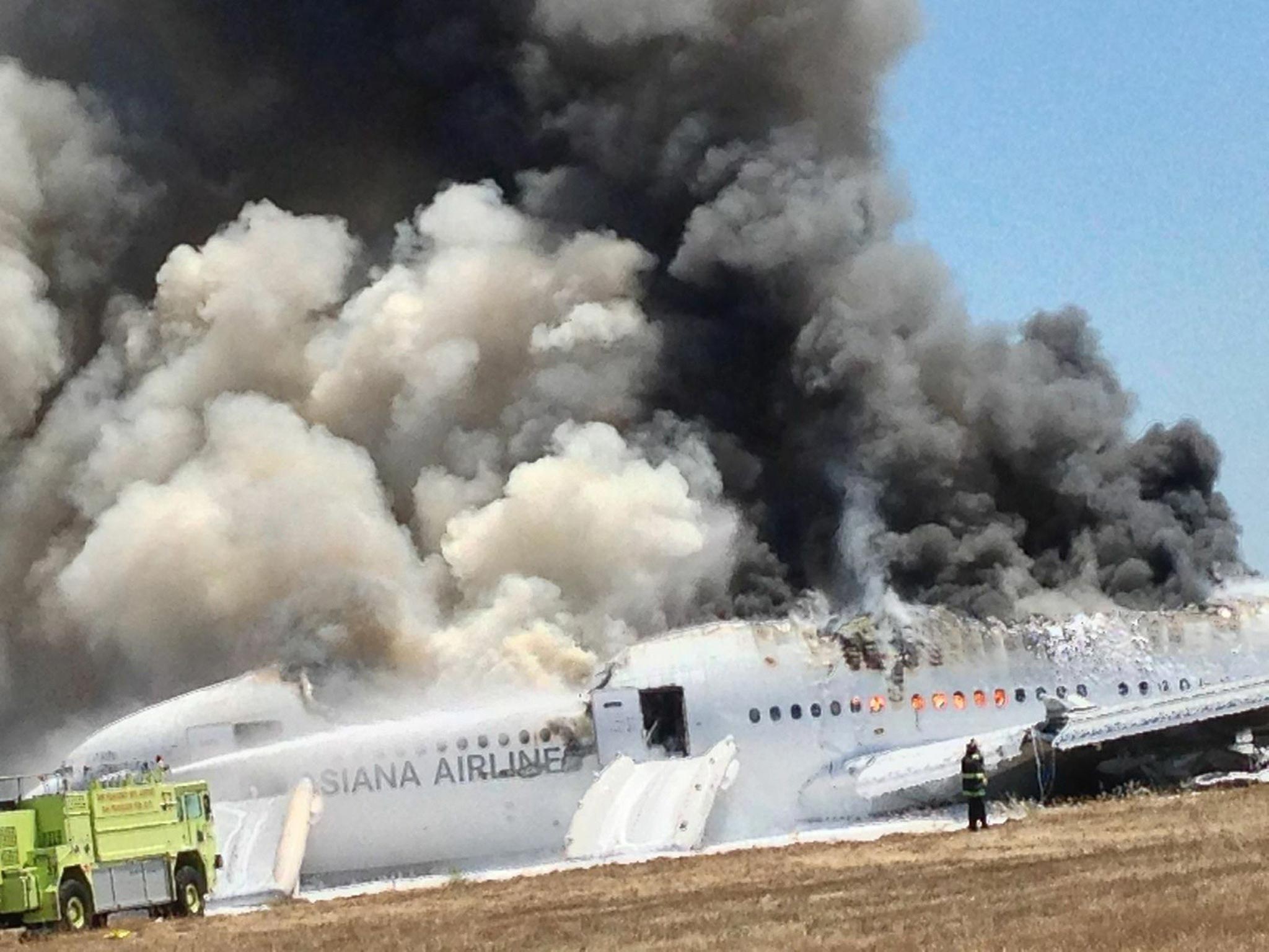 Asiana Airlines Boeing 777 is engulfed on the tarmac after crash landing at San Francisco International Airport in San Francisco, California