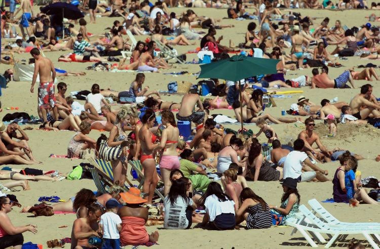 Revellers soak up the sun in Bournemouth on Sunday