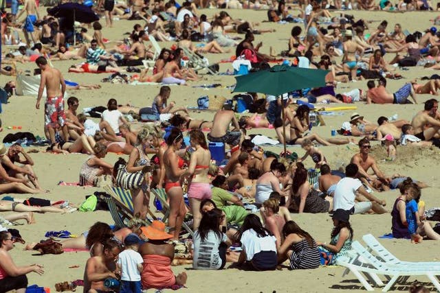 Revellers soak up the sun in Bournemouth on Sunday