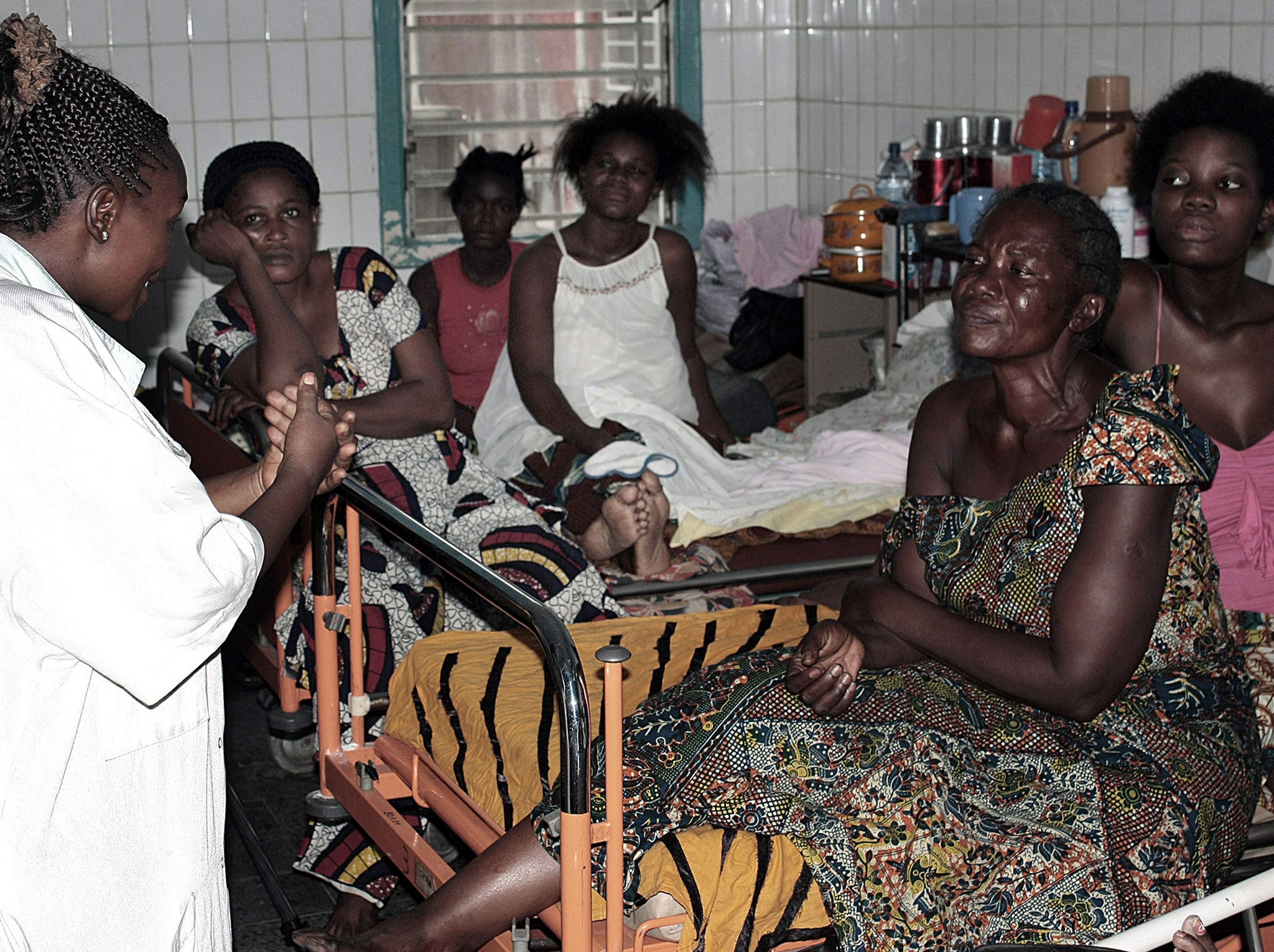 Women admitted into the maternity ward at Roi Baudoin hospital in Kinshasa are counselled by a staff member after they've been detained at the hospital for non-payment of medical fees, on March 3, 2010. Thousands of new mothers are detained in hopsitals in the Democratic Republic of Congo capital, Kinshasa with authorities estimating that at least 20 per cent of women among up to 200 patients-a-month admitted into labour wards are held in hospitals, for months sometimes, for lack of funds to pay their medical bills following childbirth.