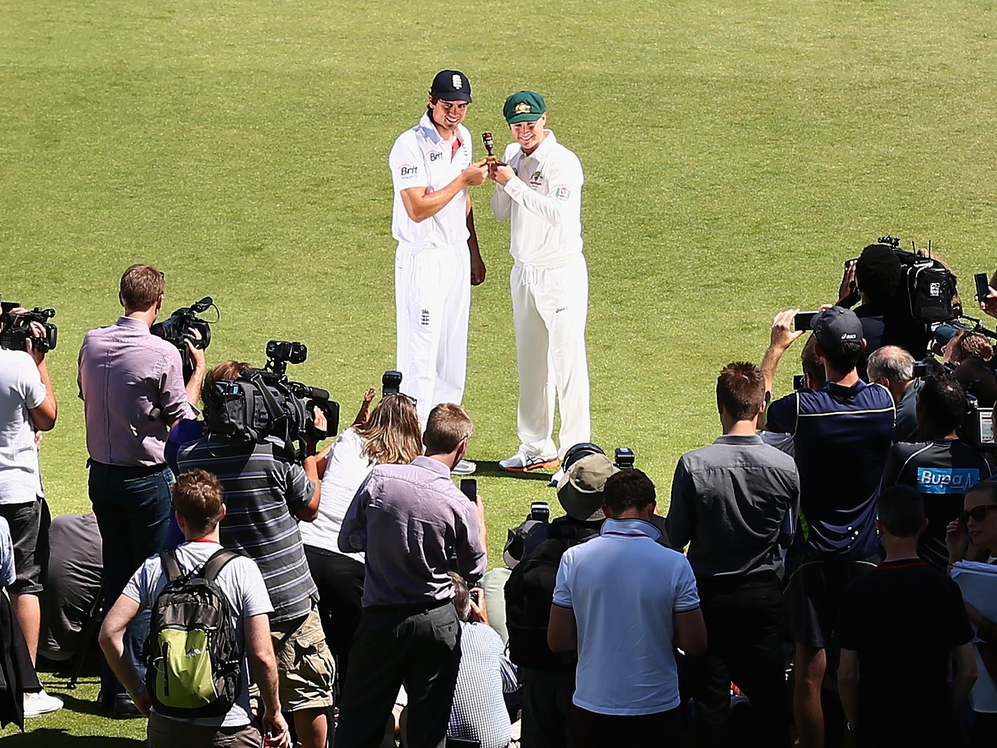 England captain Alastair Cook and Australia captain Michael Clarke pose with the Ashes urn