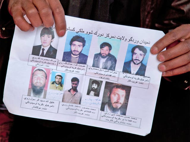 A missing-persons poster shows nine men, who, their relatives say, were last seen being arrested by US special forces in Wardak province