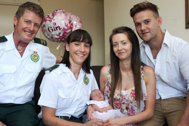 The medical crew with mother Melissa Cavanagh, father Paul Yeomans and baby Ella