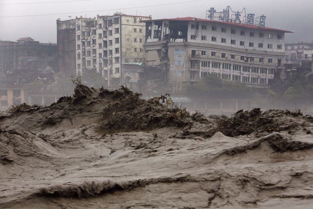 Heavy flood waters sweeping through Beichuan in southwest China's Sichuan province