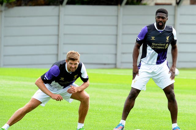Kolo Toure trains for Liverpool alongside captain Steven Gerrard