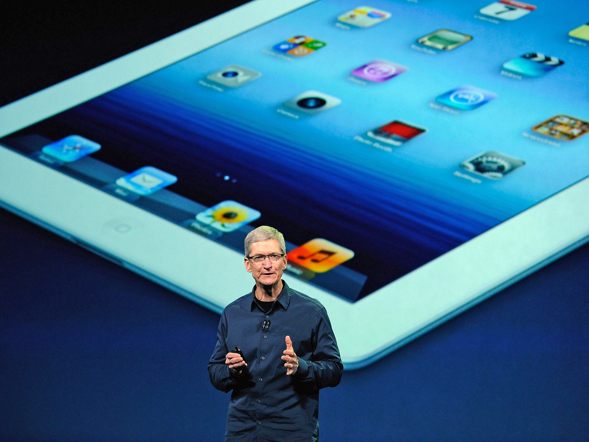 Apple CEO Tim Cook unveiling the latest iPad in 2012
