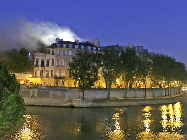 Firemen struggle to contain the blaze at the Paris mansion