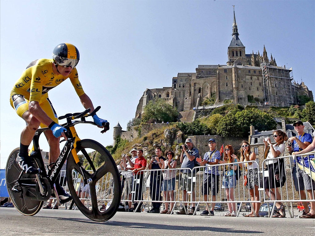 Chris Froome passes Mont Saint-Michel in Wednesday’s time trial