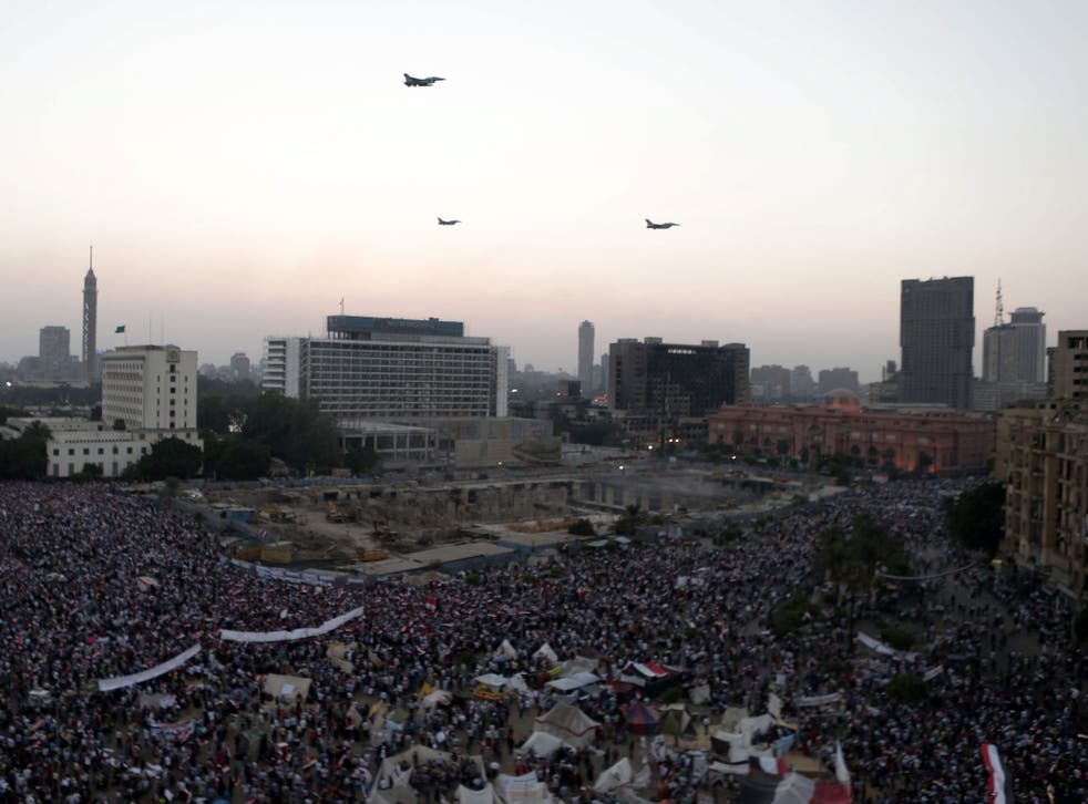 F16 jets supplied by the US fly over Tahrir square in Egypt