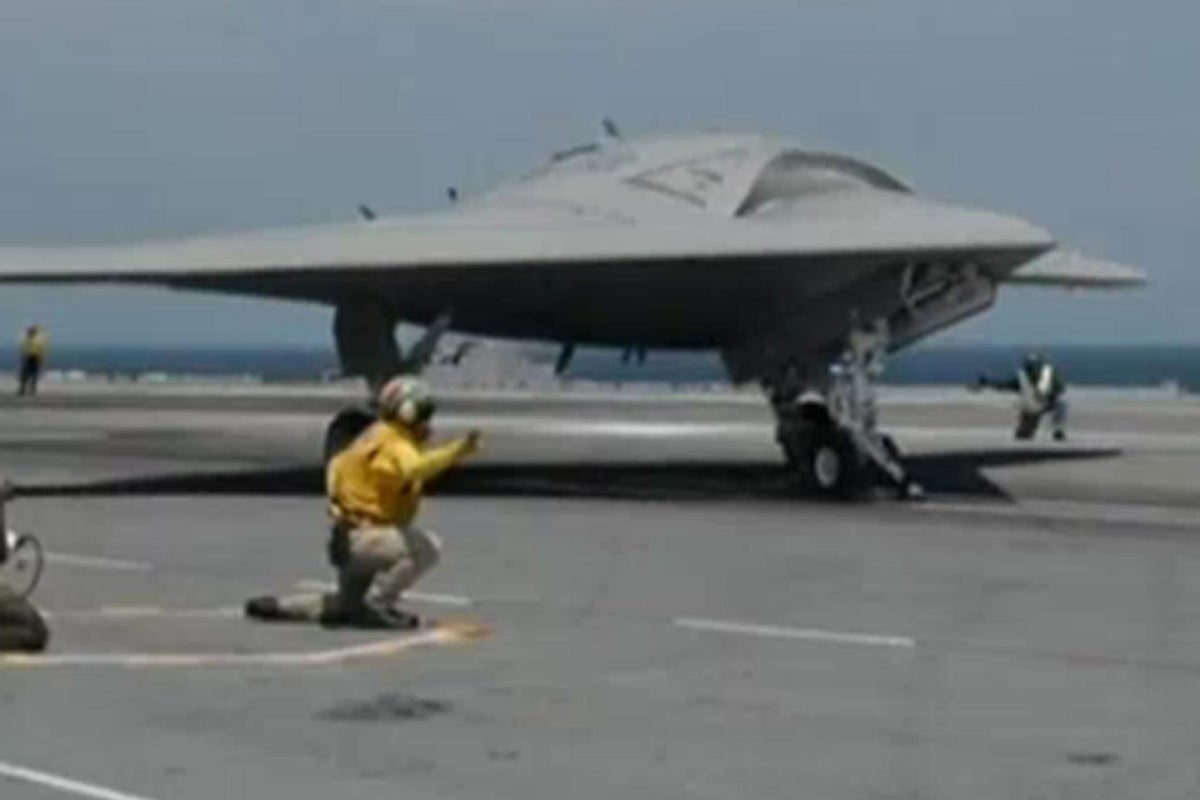 Unmanned X-47B jet makes history after successfully landing on aircraft ...
