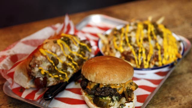 The 'Triple Chilli Challenge' involves a plate of chilli cheese fries, a chilli dog, and a green chilli burger