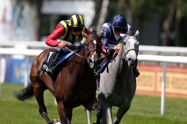 Elusive Kate (left) holds Sky Lantern in the Falmouth Stakes at Newmarket yesterday 