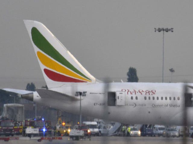 Emergency services attend to a Boeing 787 Dreamliner, operated by Ethiopian Airlines, after it caught fire at Heathrow airport