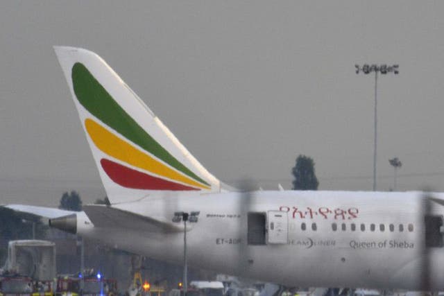 Emergency services attend to a Boeing 787 Dreamliner, operated by Ethiopian Airlines, after it caught fire at Heathrow airport