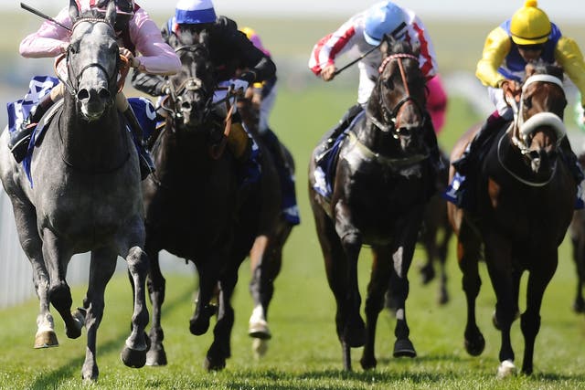 Force of nature: Adam Kirby sends the impressive Lethal Force (far left) clear of his rivals to win the July Cup at Newmarket after giving him a brief reminder 