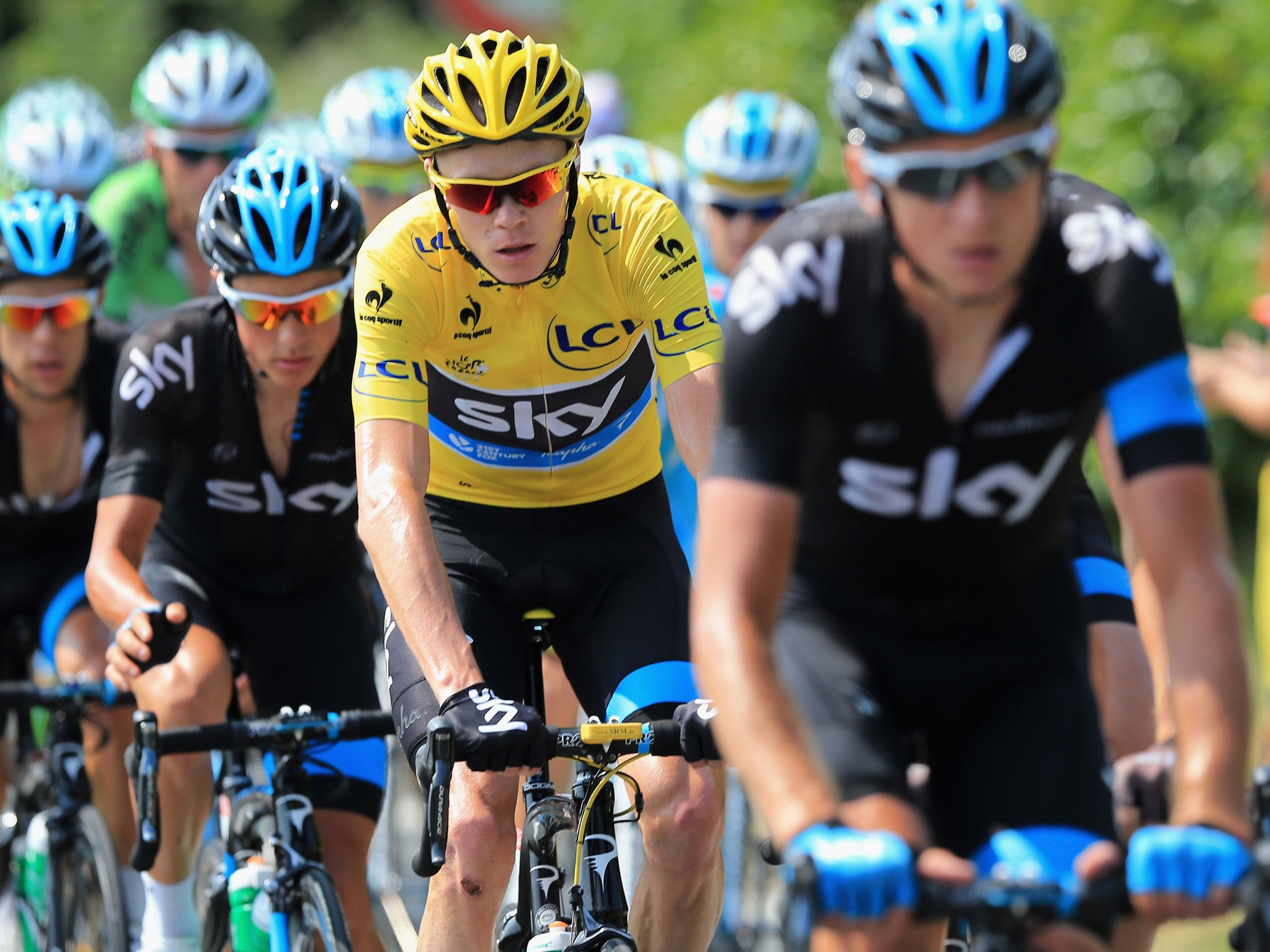 Boxing clever: Chris Froome and Sky protect the yellow jersey on Stage 14