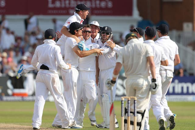 Closing in: Graeme Swann is mobbed after trapping Steve Smith lbw just one ball after Michael Clarke was caught behind