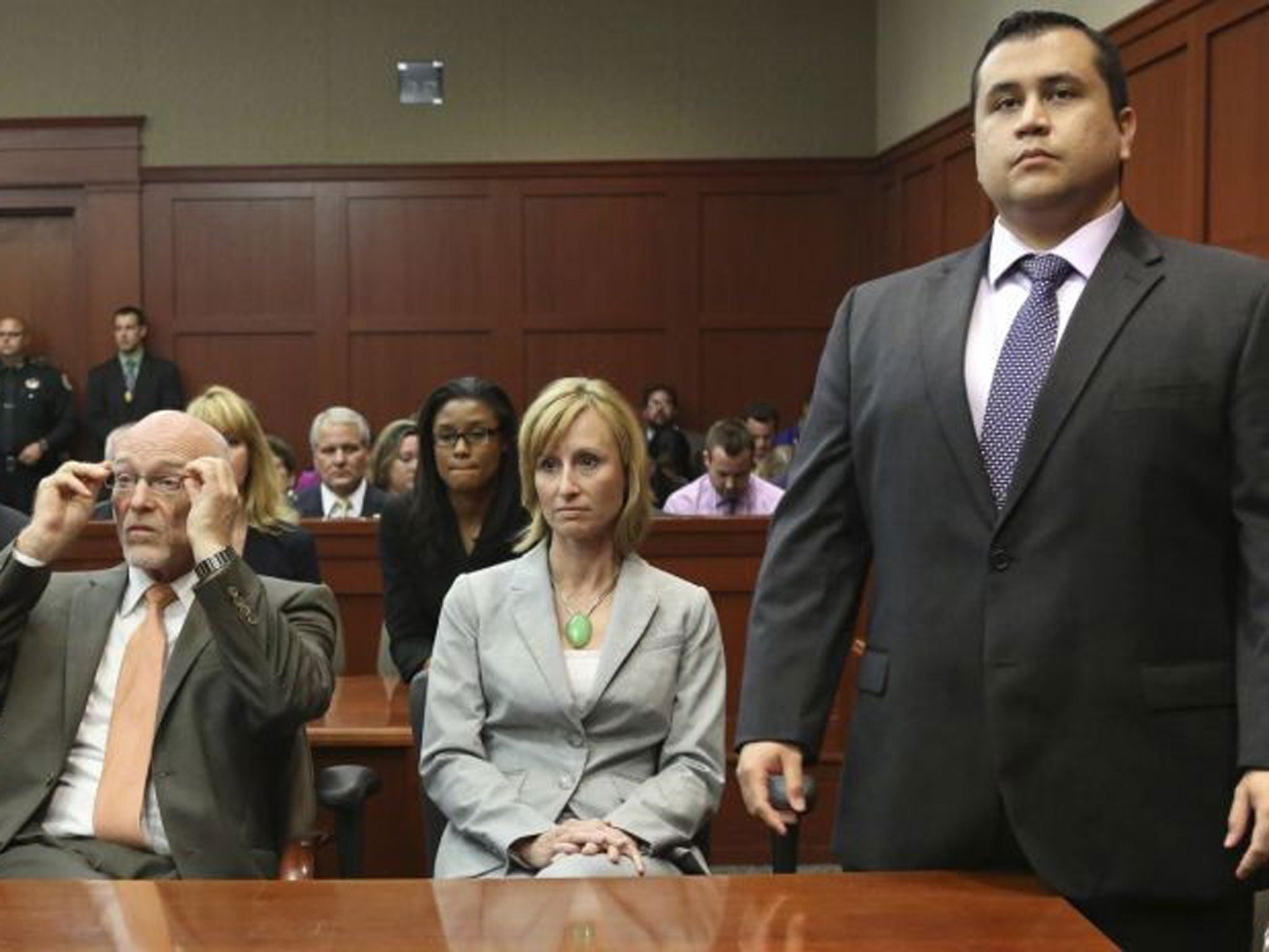 George Zimmerman stands when the jury arrives to deliver the verdict 