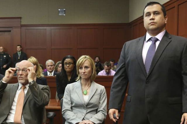 George Zimmerman stands when the jury arrives to deliver the verdict 